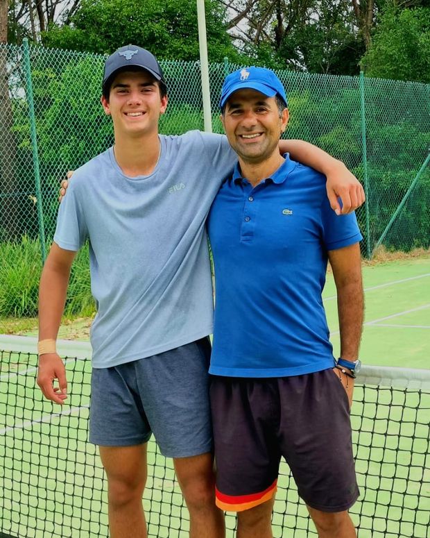 Hadi with his student Myron on court