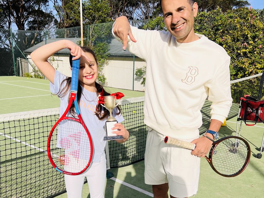 A junior player with their trophy