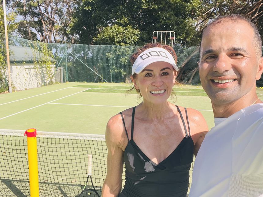 Hadi with an adult player after a private lesson
